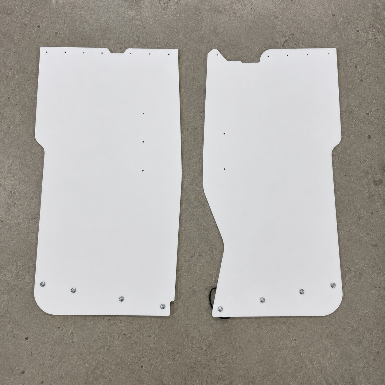 GR Yaris rear suspension guards seen from the bottom showing the flat bottom with round head bolts for mounting