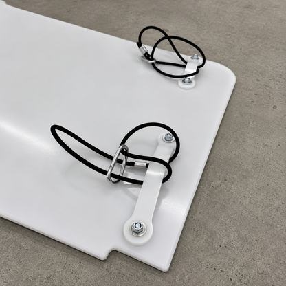 GR Yaris rear suspension guard mounting system shown in detail with rubber bands, carabiner clips and plastic hooks