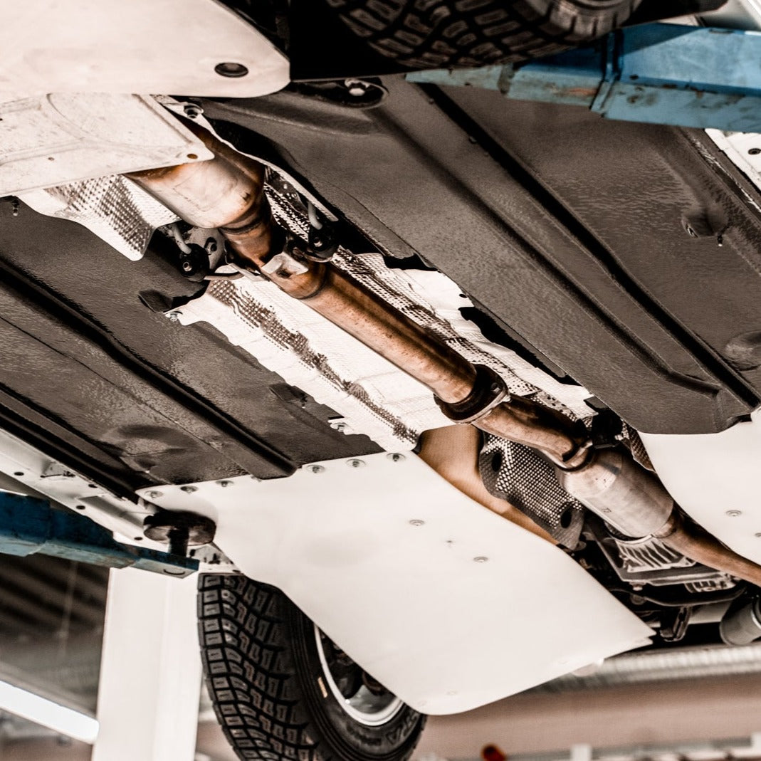 GR Yaris rear suspension guards shown mounted to the car along with Neomatic Floor Guard Kit